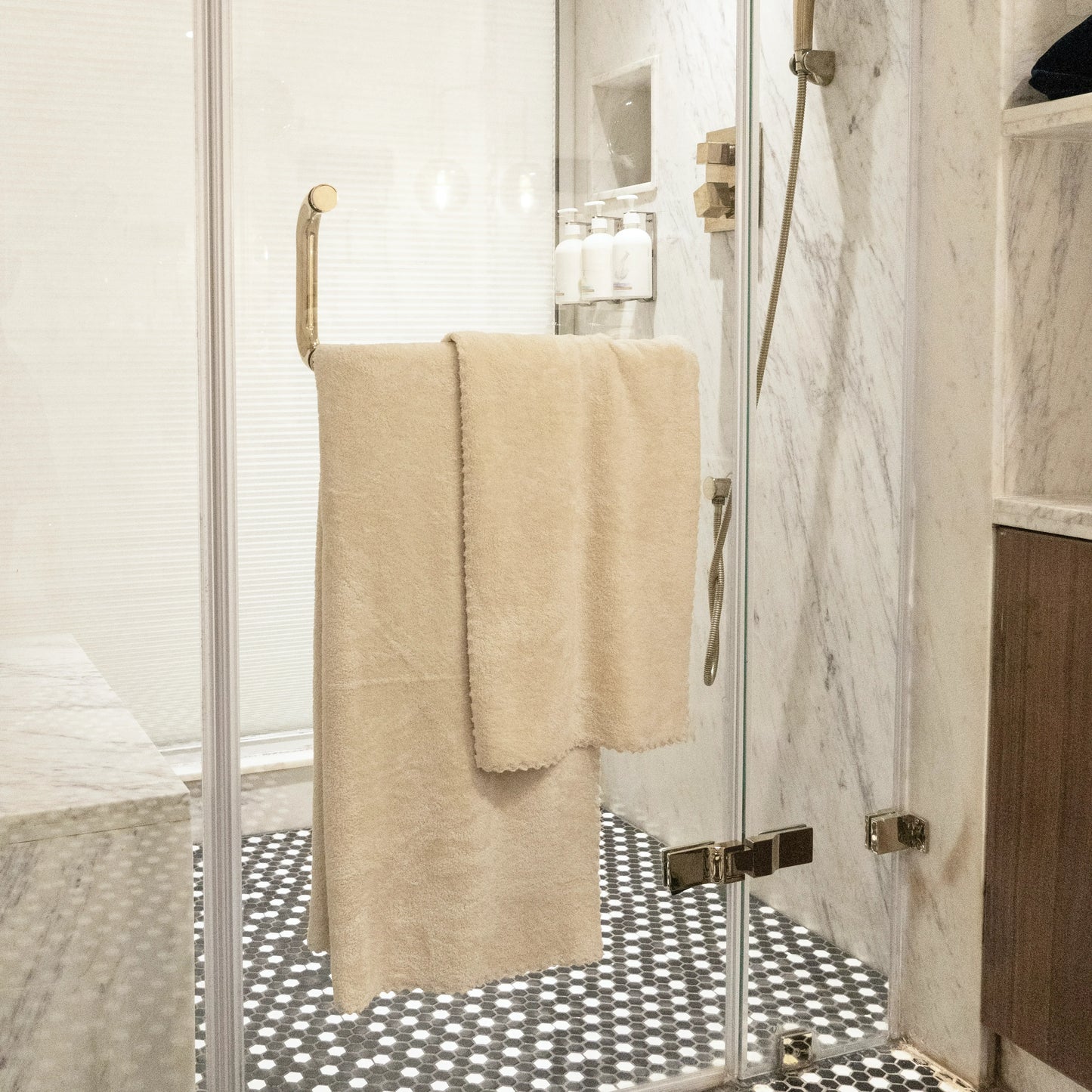 Light cream Soft Craze towel set arranged in a stack showing size variation