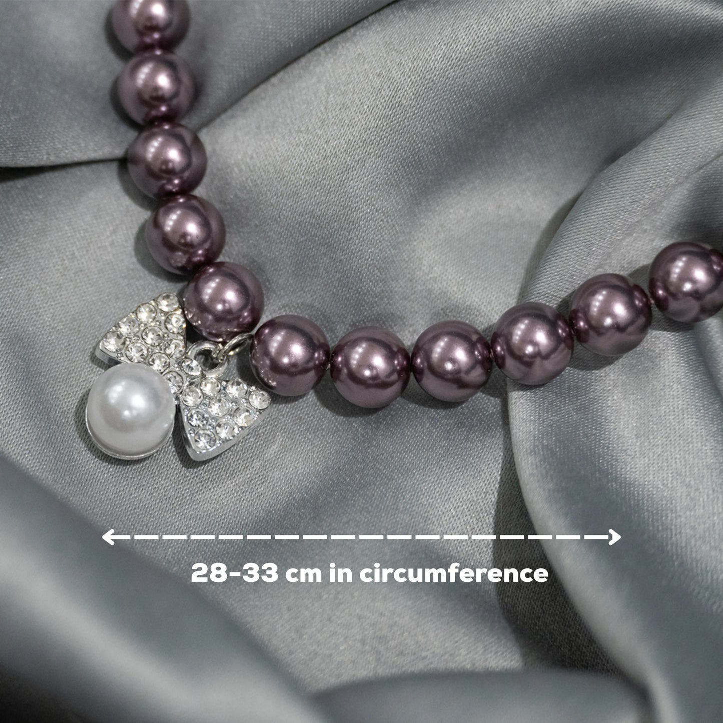 Close-up of necklace wine beads with bow