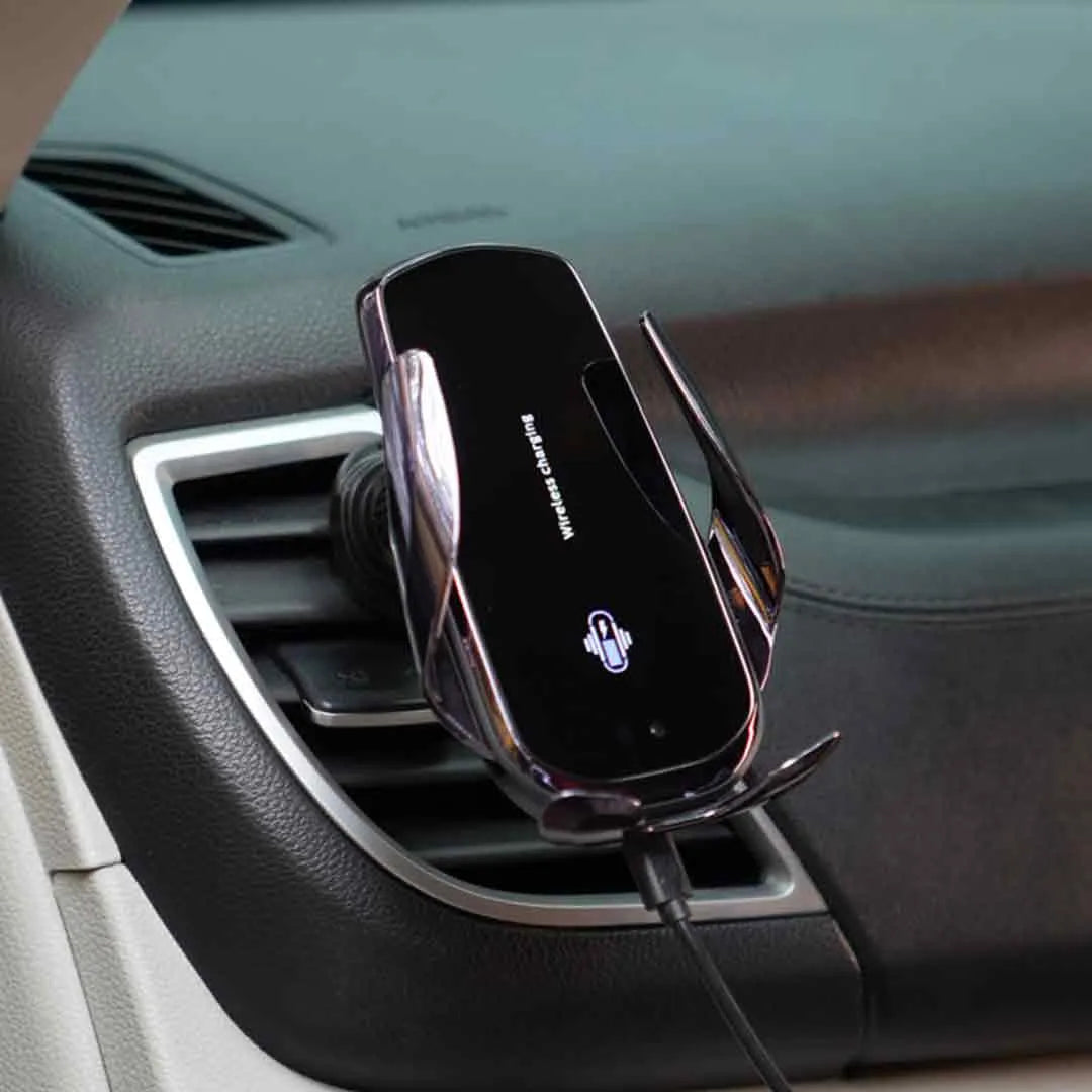 15W automatic clamping wireless charger mounted on a car dashboard, displaying rotating phone holder feature