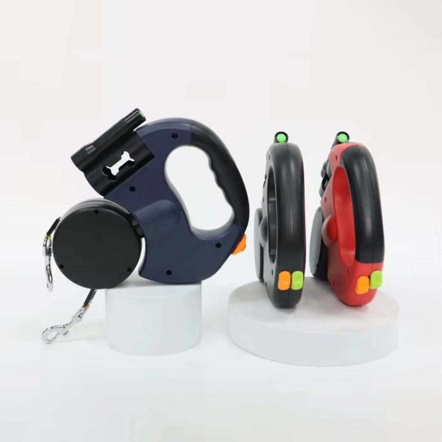 Two dogs exploring on separate retractable leads
