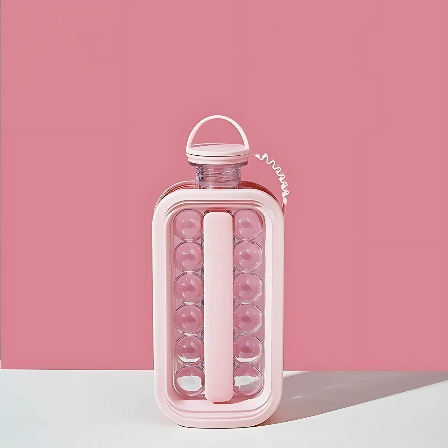 Ice cube maker bottle with ball molds, perfect for making transparent ice cubes at home.
