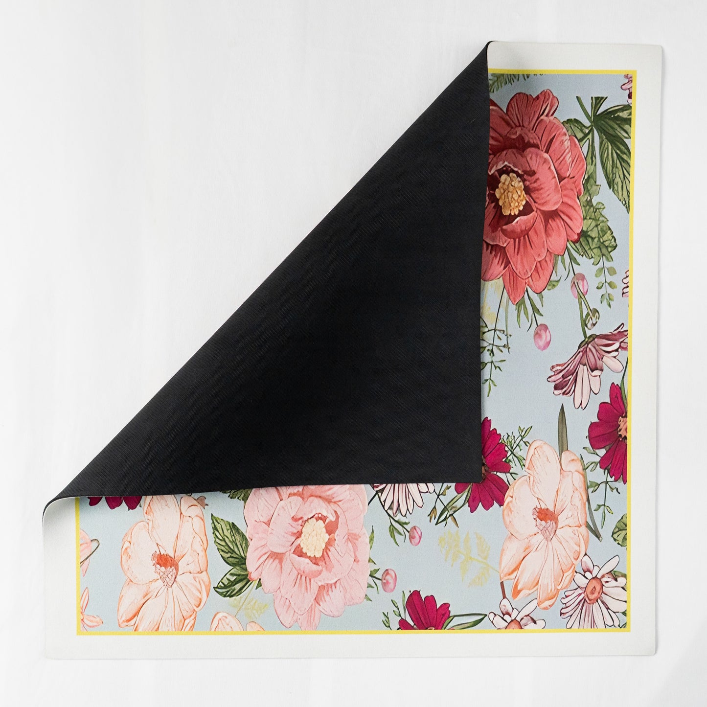 Cream mat folded slightly showing backside.