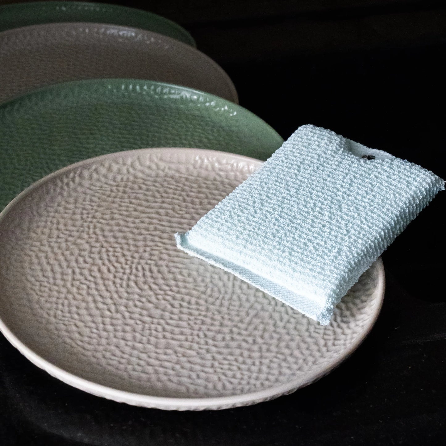 compact blue oil wipe placed on the plate