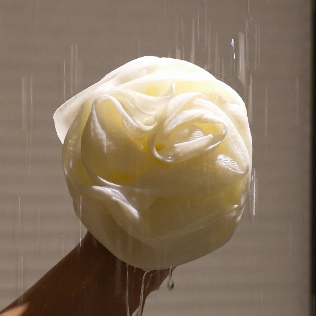 Close-up of Foam Ease Plush Loofah showing dense mesh and comfortable grip