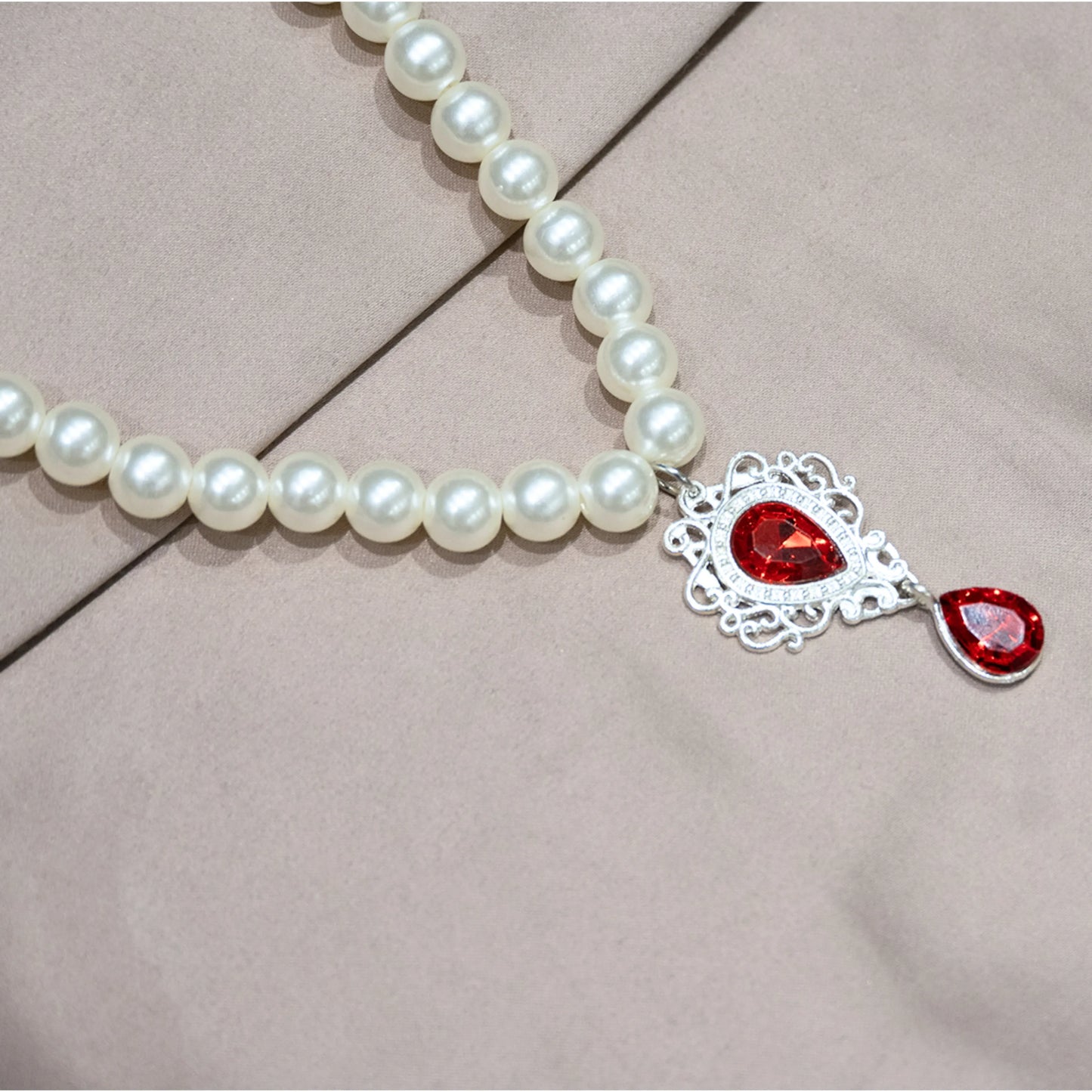 Pet pearl necklace with red semi-precious gemstone pendant