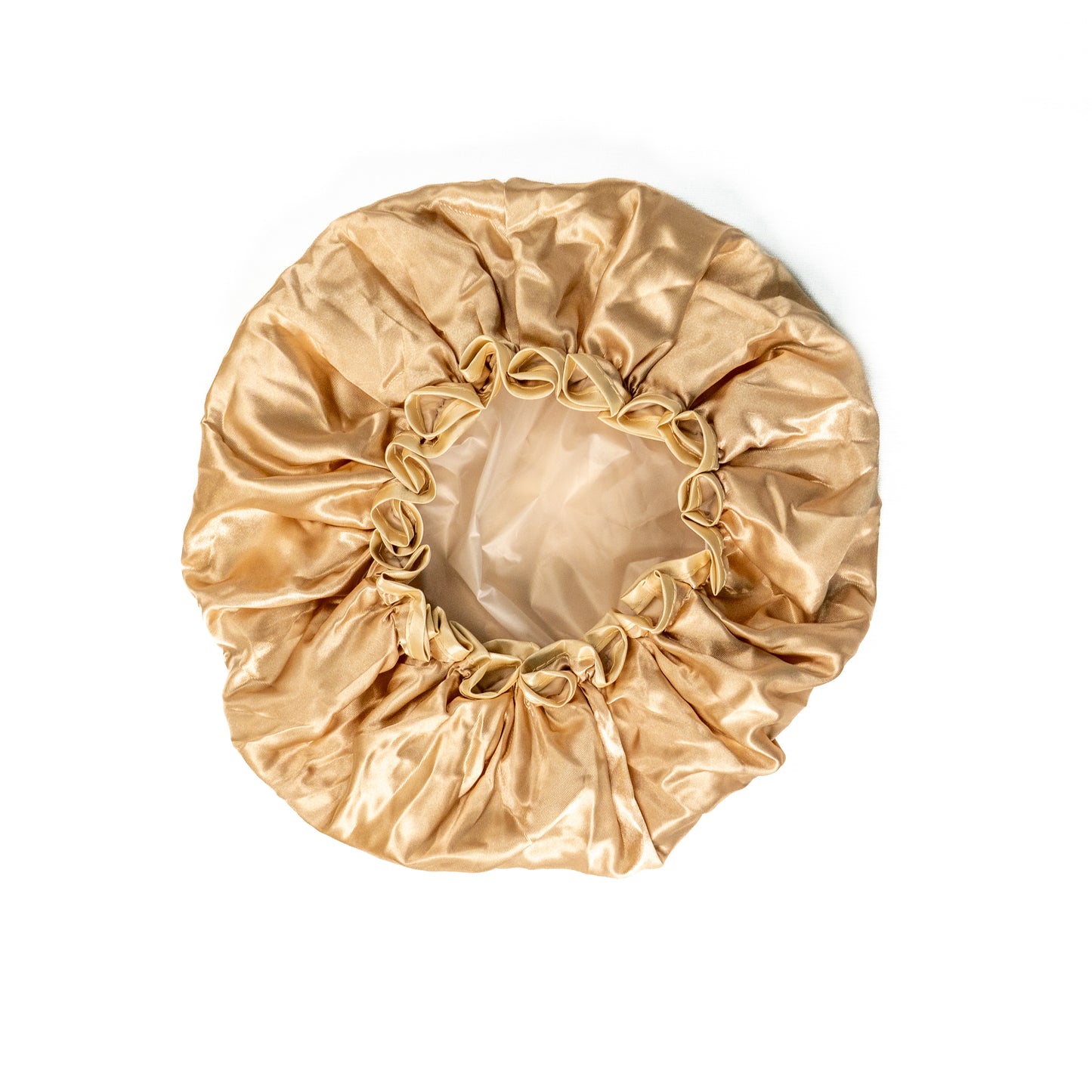 Pink shower cap from downside view on white background.