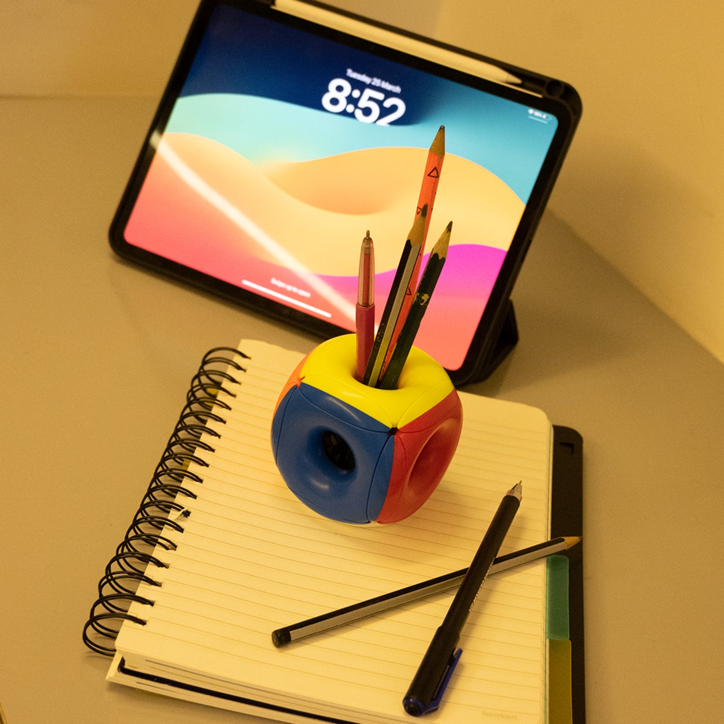 Hollow Rubix Cube used as a creative pen holder on a desk