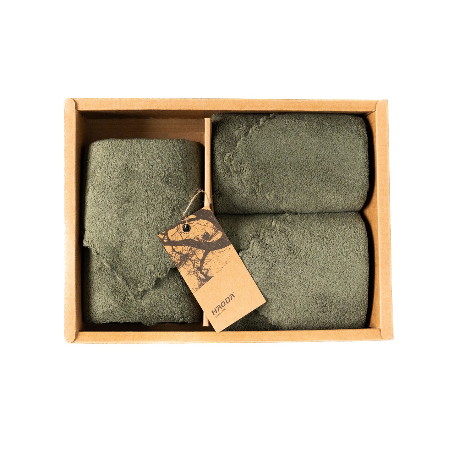 Olive green towel arranged in the box