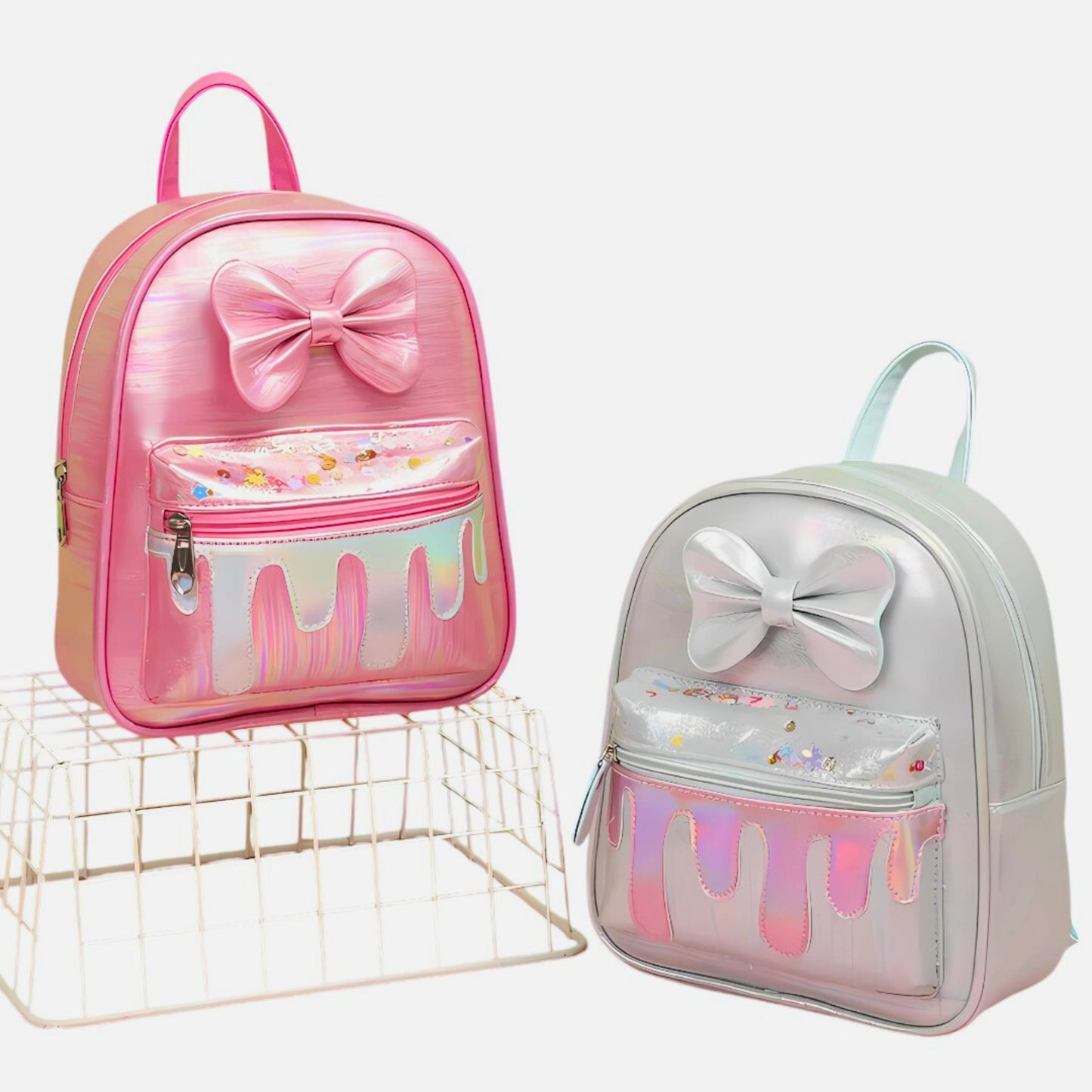 Glitter Bow Drip Kids' Backpack with sparkling bow on white background