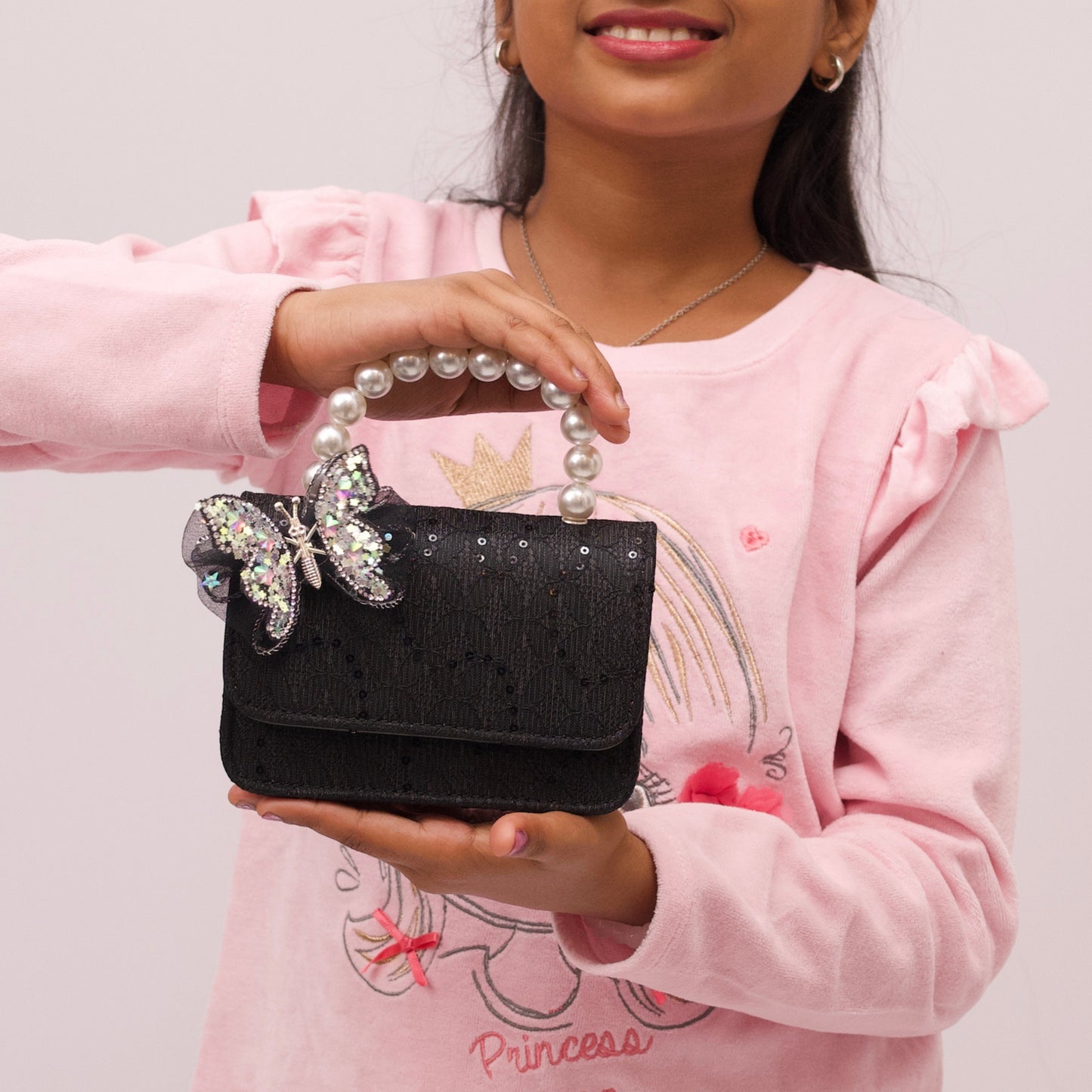 Elegant mini pouch bag with butterfly detail and cute colors