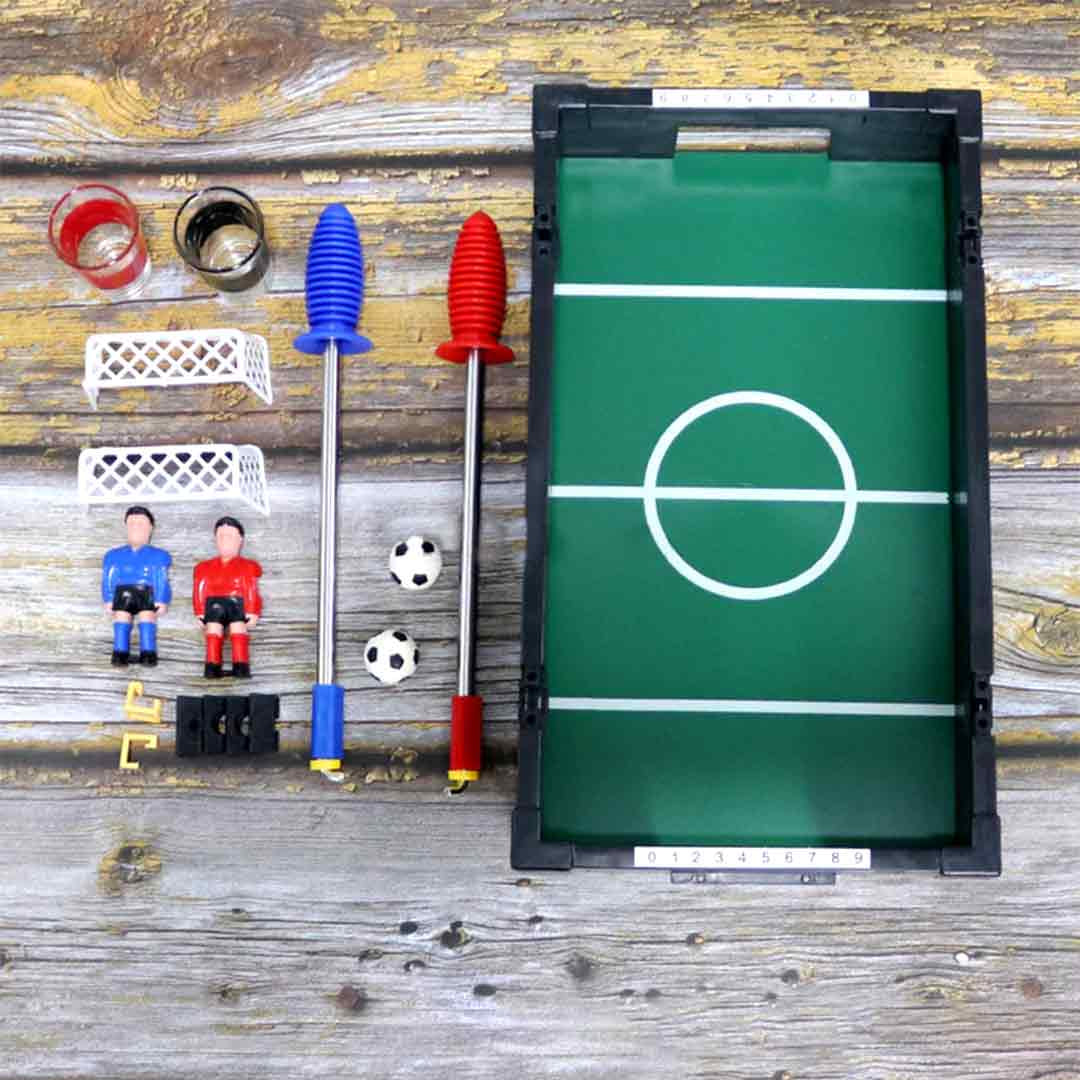 Mini foosball table with shot glasses