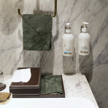 Olive green Soft Craze towel set styled in a spa-like environment