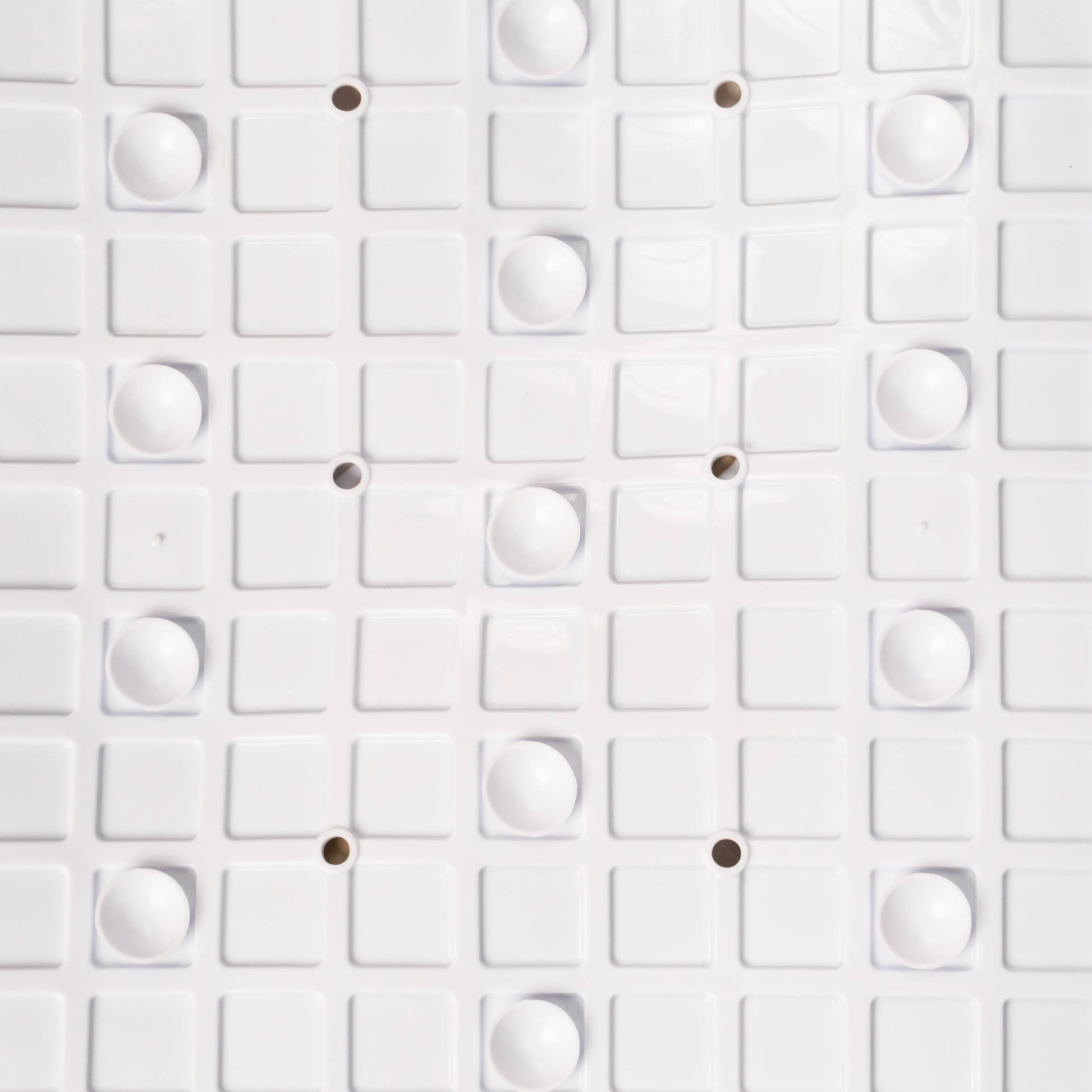 Close-up view of bathroom mat backside texture.