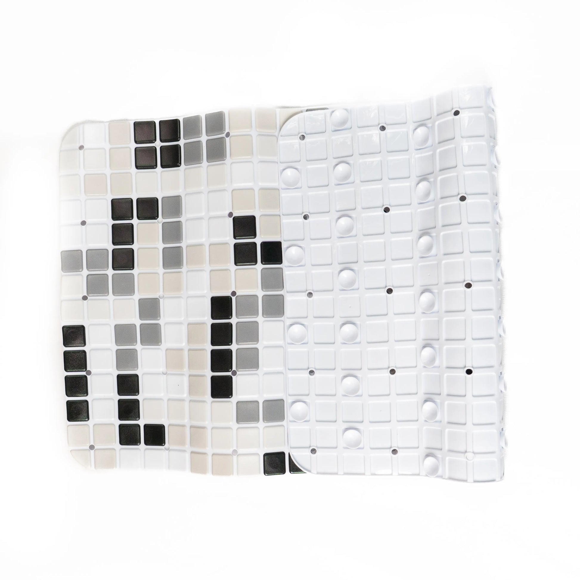 Black-white bathroom mat slightly folded, showing back side.