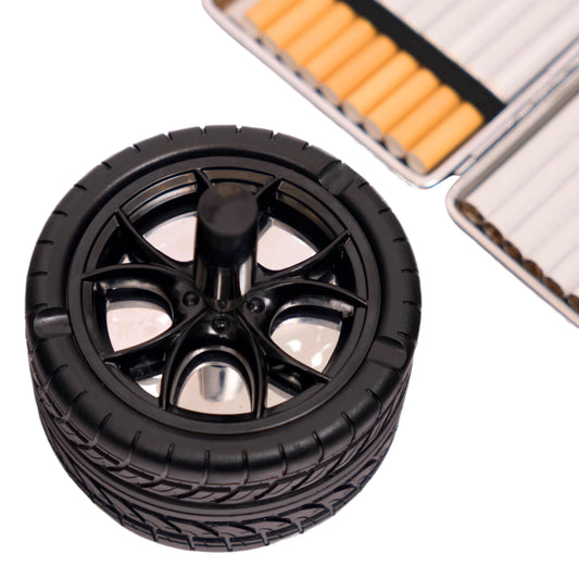Round black wheel-shaped cigarette case with open cases in background.