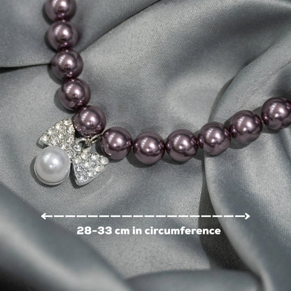 Close-up of necklace wine beads with bow