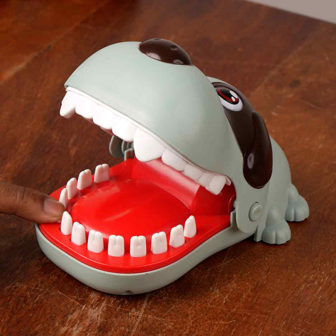 Bite the Button Game snapping dog on a table ready to play