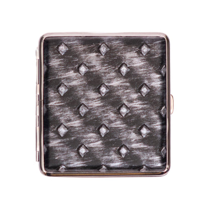 Square cigarette case with metallic silver diamond pattern.