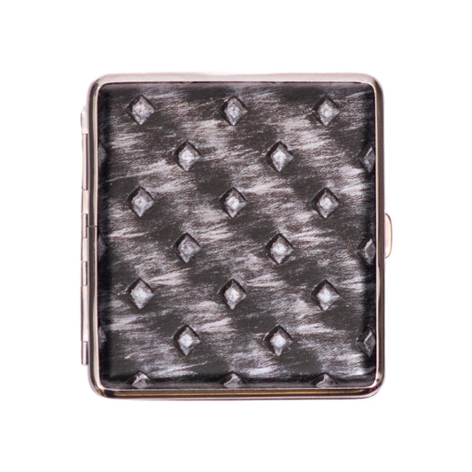 Square cigarette case with metallic silver diamond pattern.