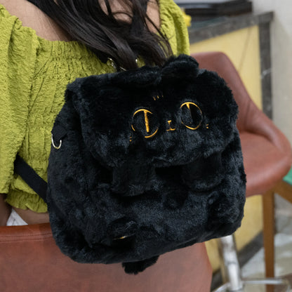 Fluffy black convertible backpack on a women