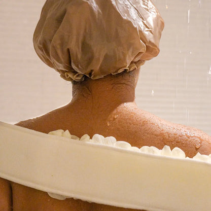 Woman using the white glow loop on her back.