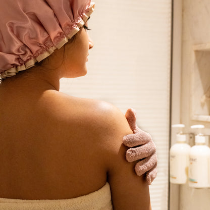 Detailed shot of soft peach bath gloves