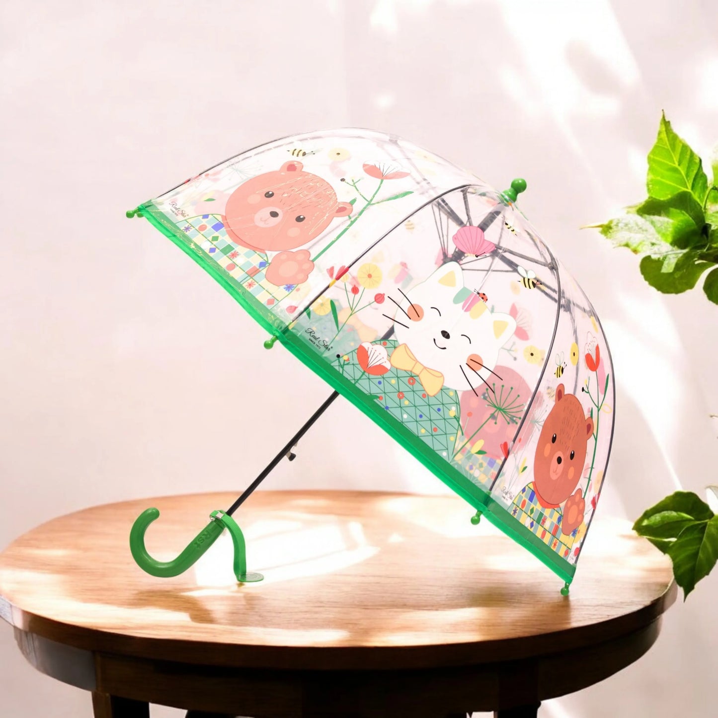 Close-up of pink animal cartoon umbrella handle and design