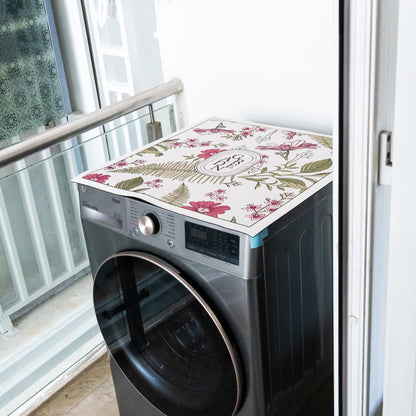 Pink mat placed on top of washing machine.