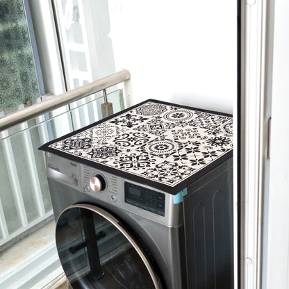 Black mat placed on top of washing machine.
