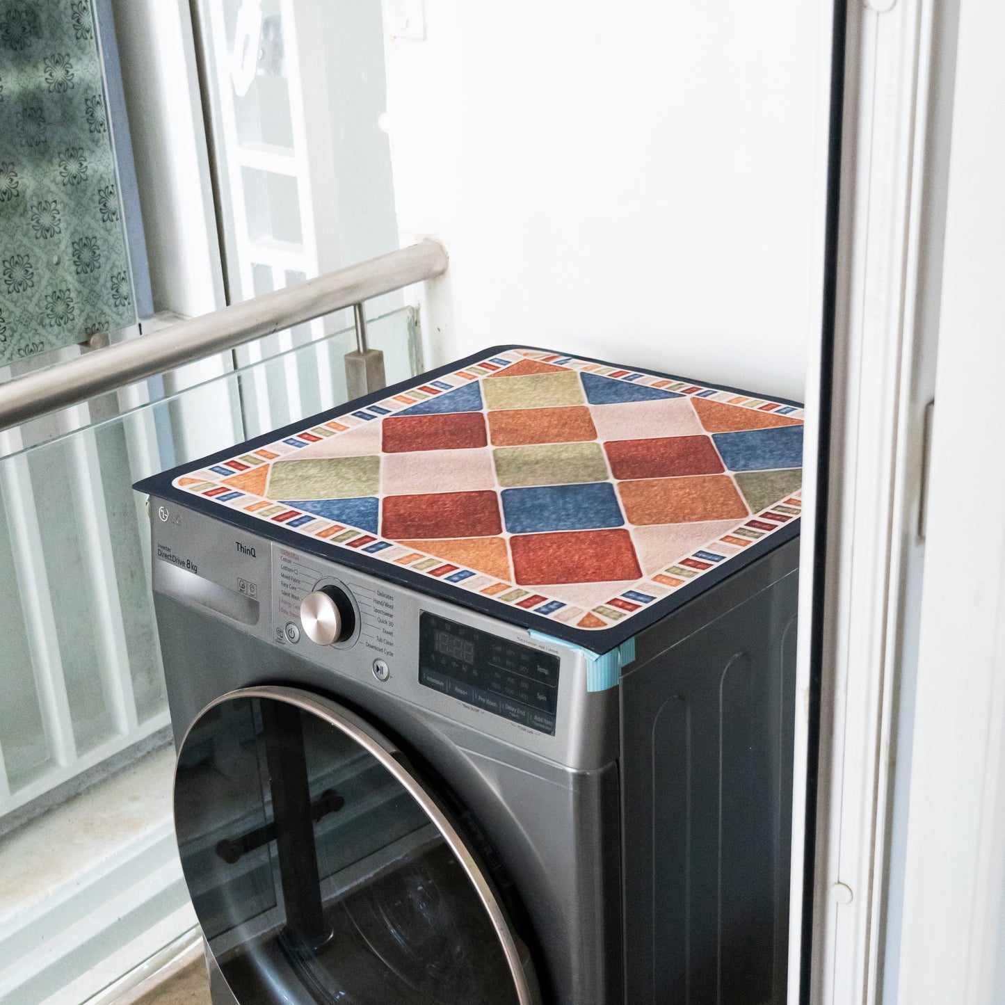 Checked pattern mat placed on top of washing machine