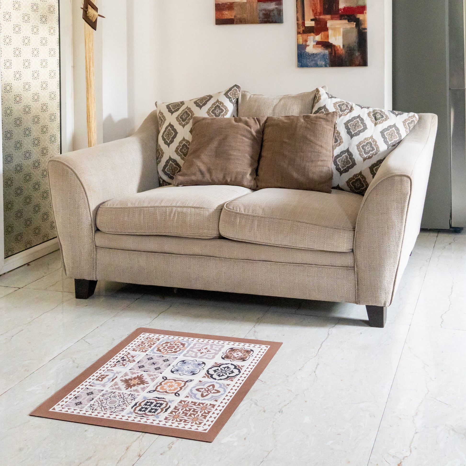 Beige mat placed in front of sofa.