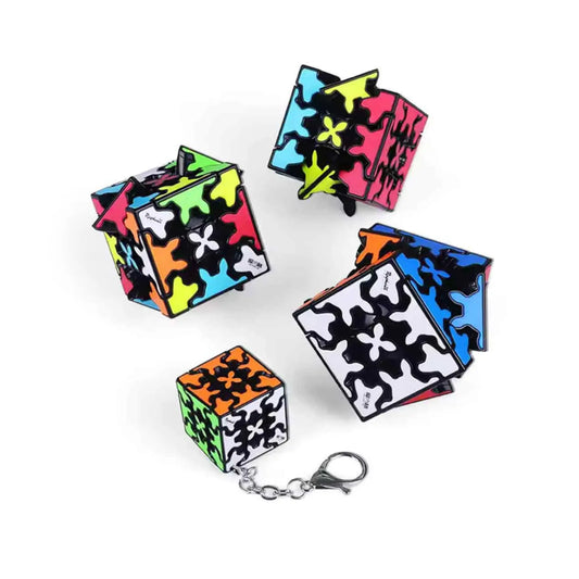 Display of neon gear cube keychain on a white background