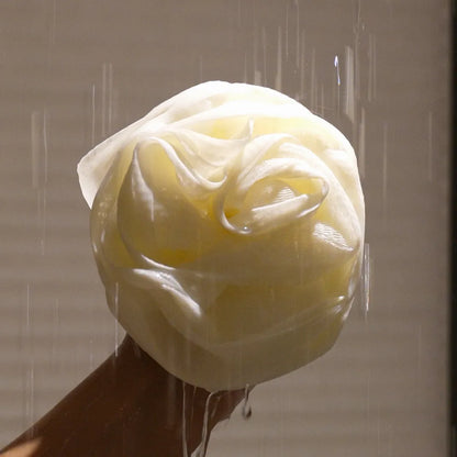 Close-up of Foam Ease Plush Loofah showing dense mesh and comfortable grip