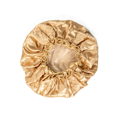 Pink shower cap from downside view on white background.