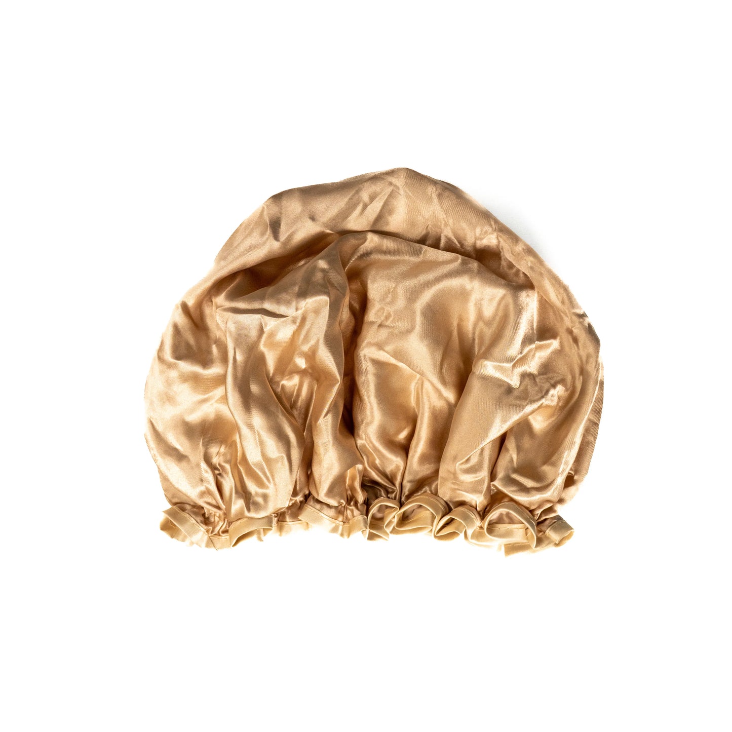 Beige shower cap from downside view on white background.