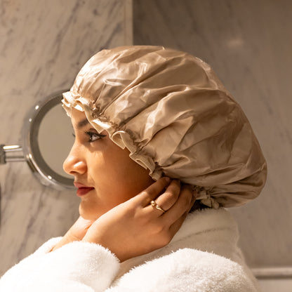 Woman wearing beige shower cap, angle 2.