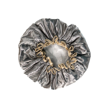 Grey shower cap from downside view on white background.