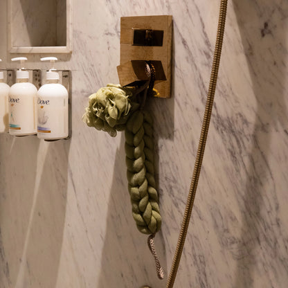 Green variant of Soothe Luxe ribbon bow bath combo displayed on natural background
