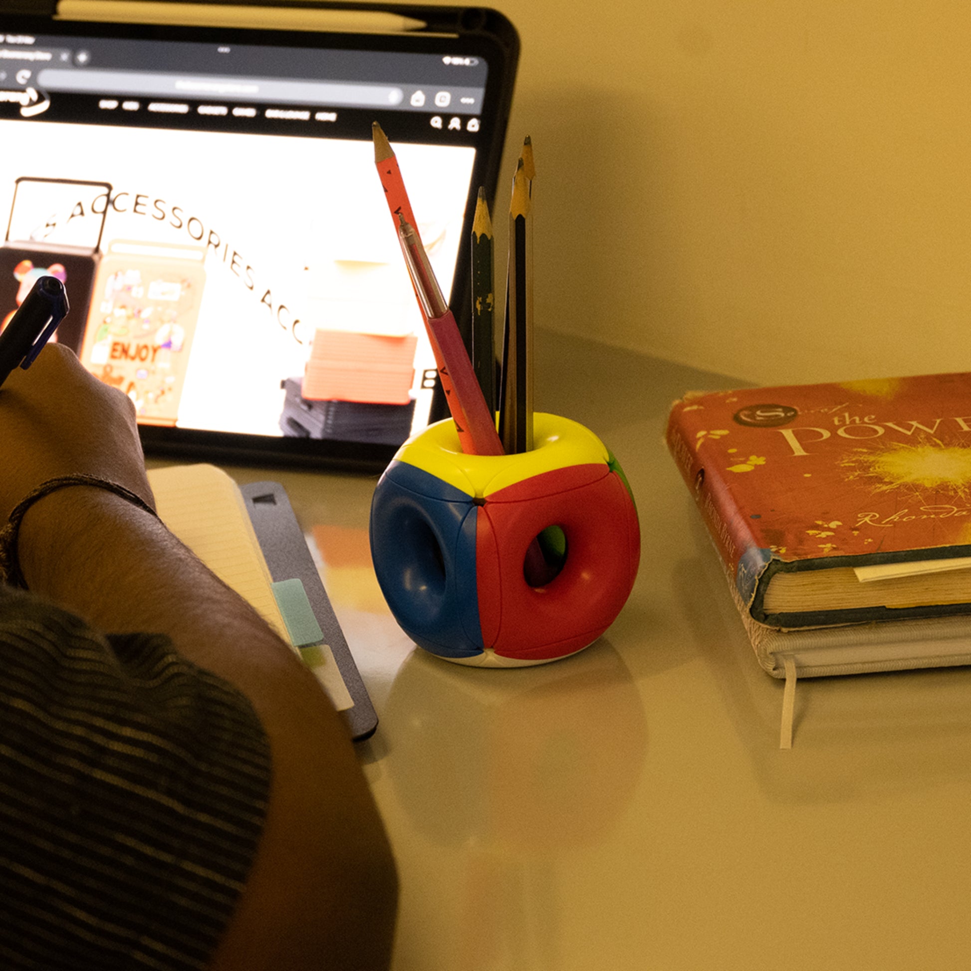 Hollow Rubix Cube resting on a laptop keyboard