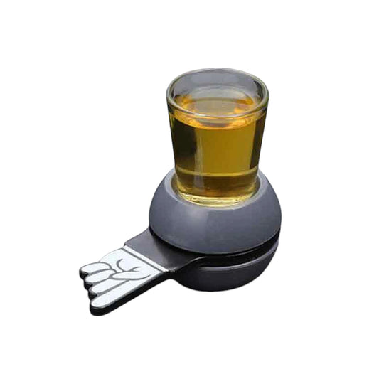 Unboxed Spin & Sip Shot Glass game setup on a table on white background