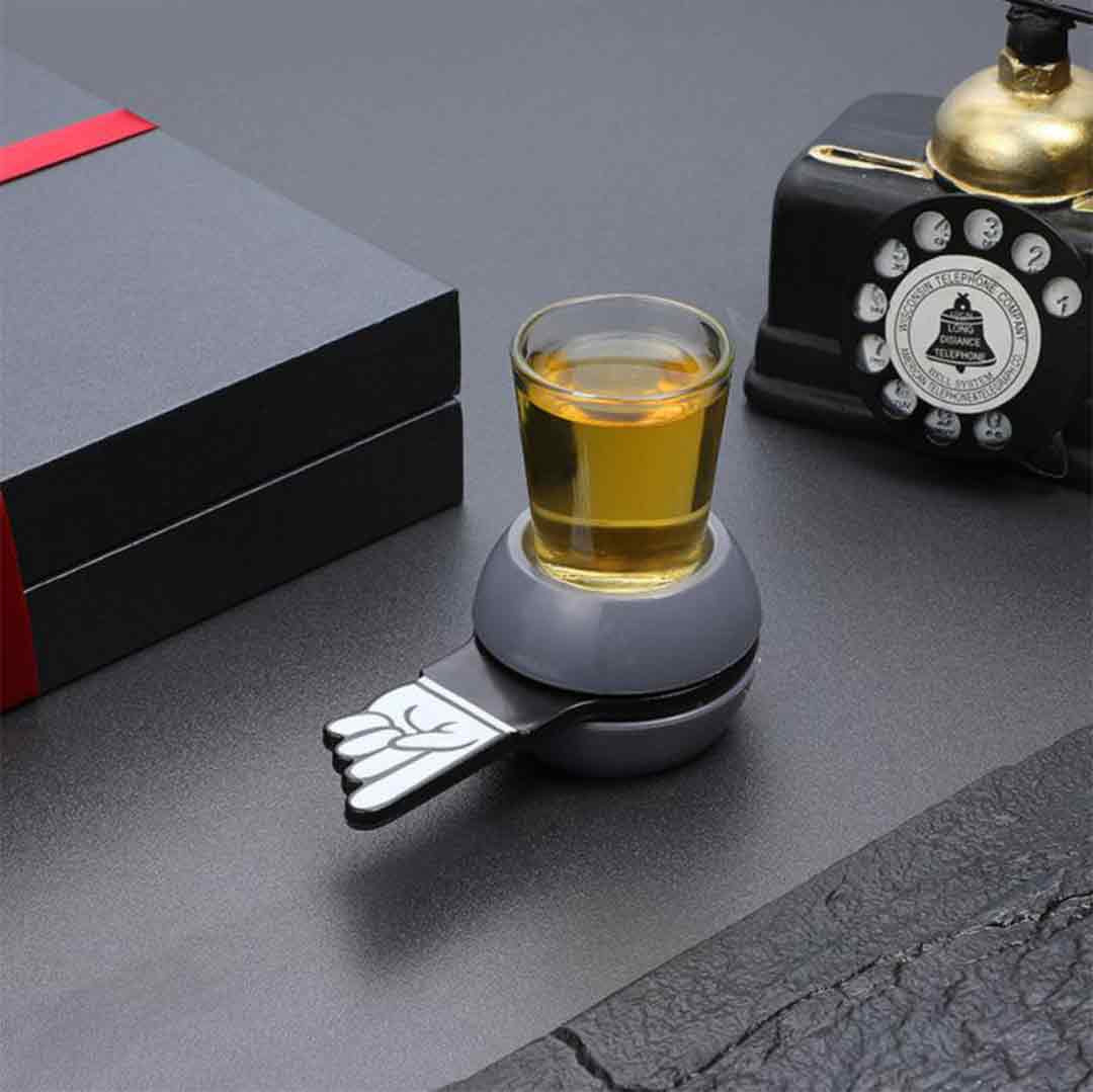 Unboxed Spin & Sip Shot Glass game setup on a table