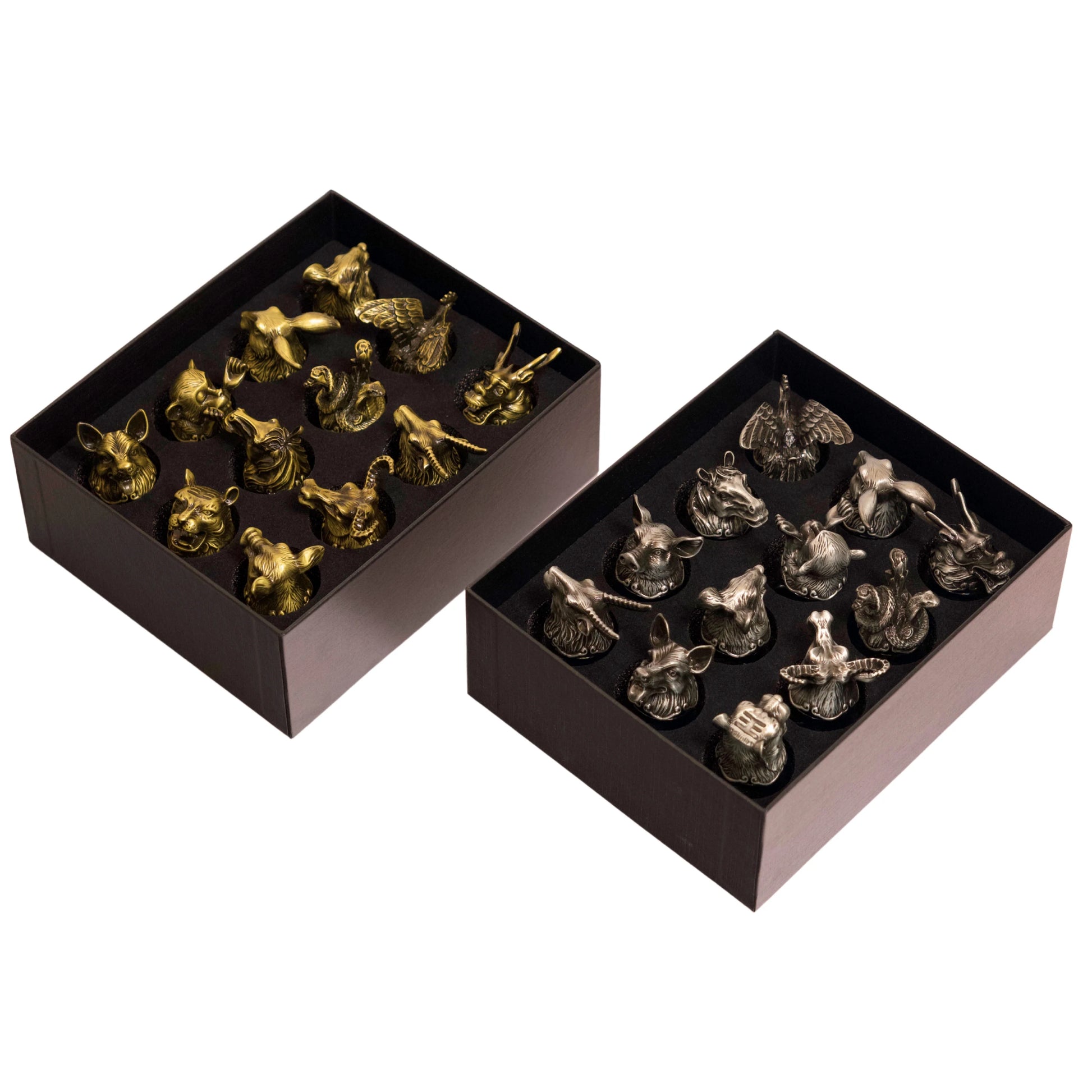 Shot glasses with animal head bases, gold and silver variations shown.