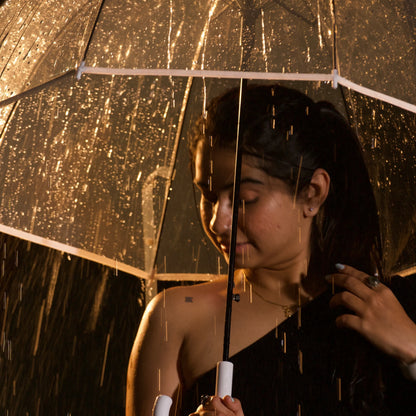 Close of woman walking with transparent hook umbrella