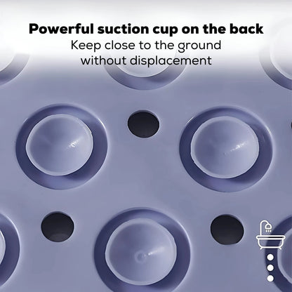 Close-up of large round suction cups on the back of a bath mat for strong grip.