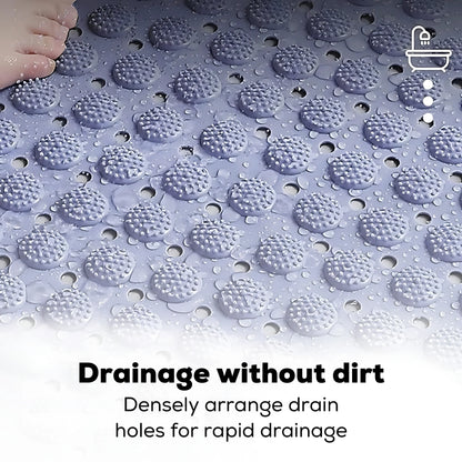 Foot pressing into soft elastic massage columns on a shower mat.