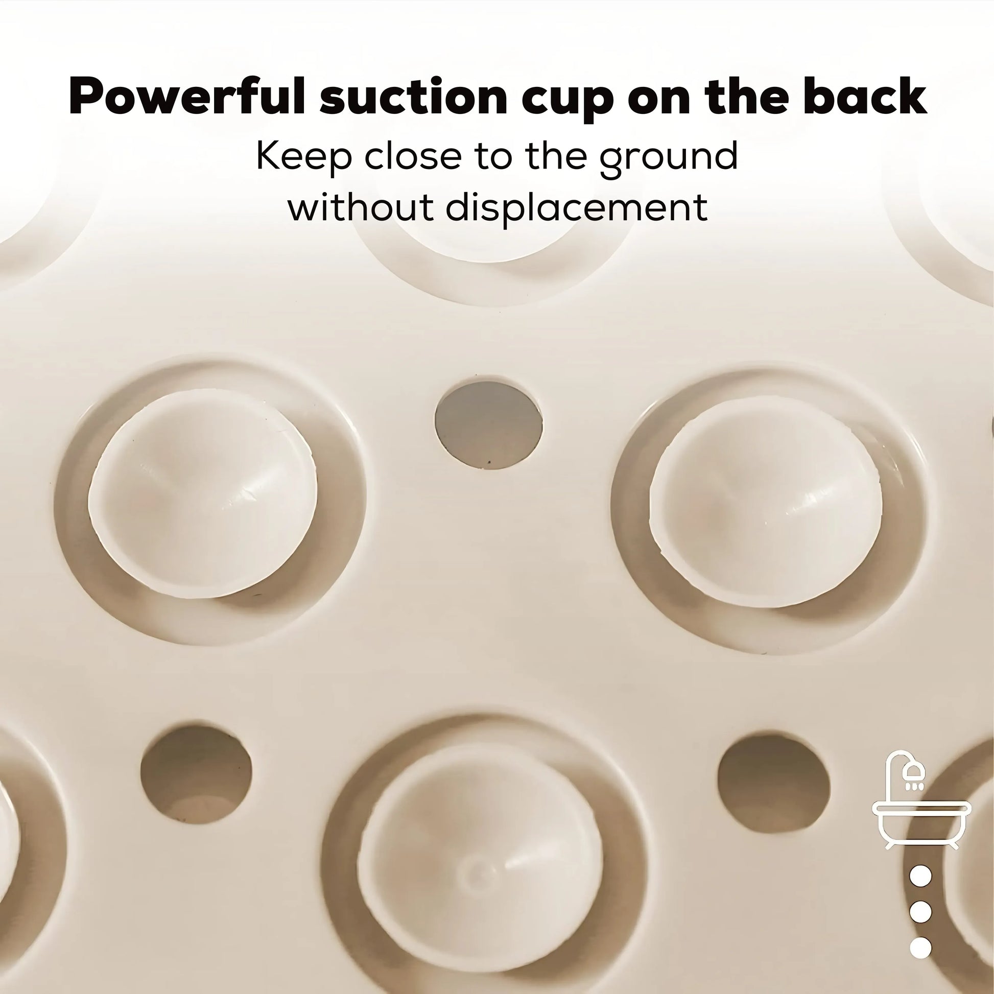 Close-up of large round suction cups on the back of a bath mat for strong grip.