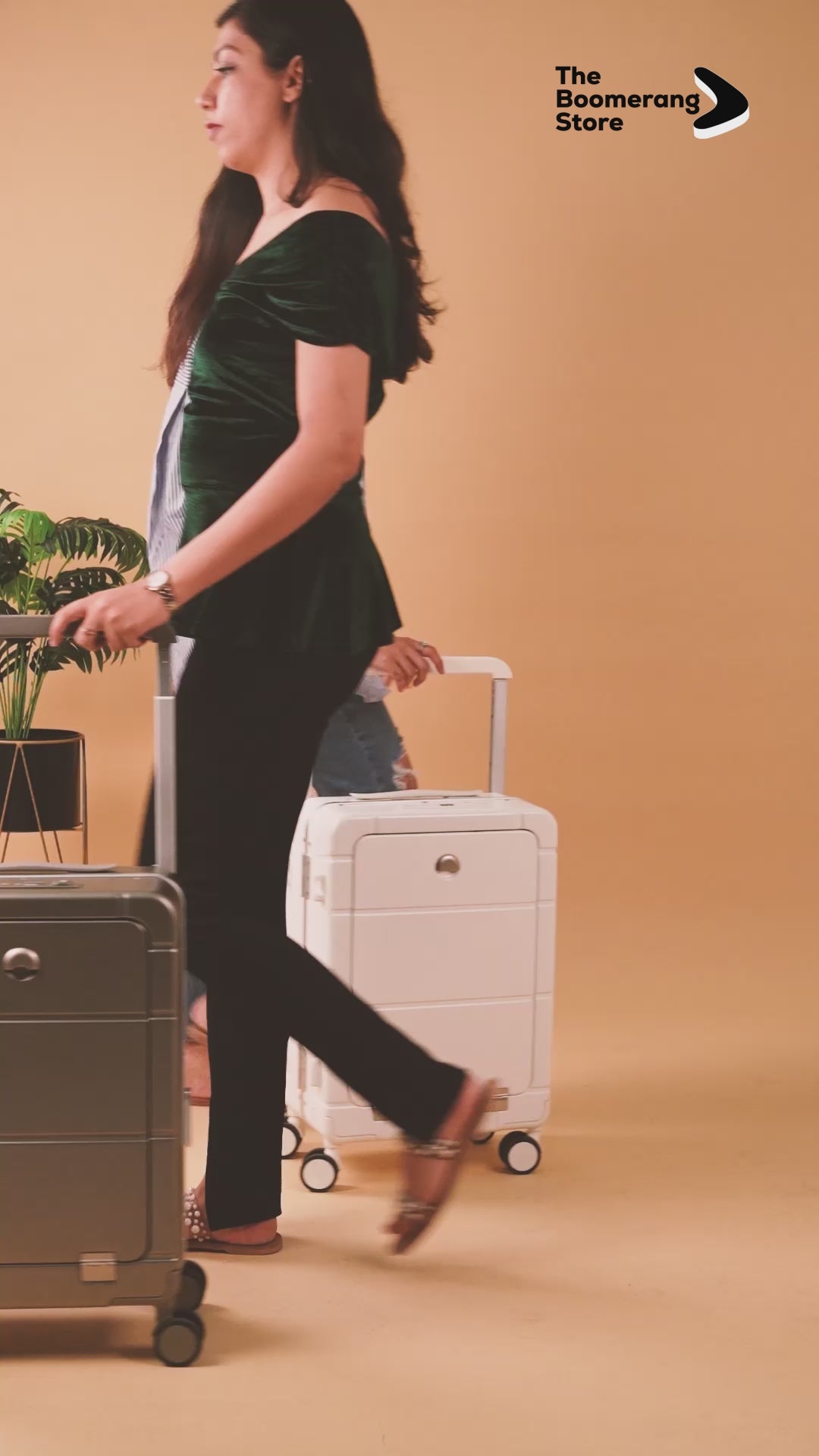 Suitcase with front open compartment, cup holder, built-in USB charging port, and smooth wheels.