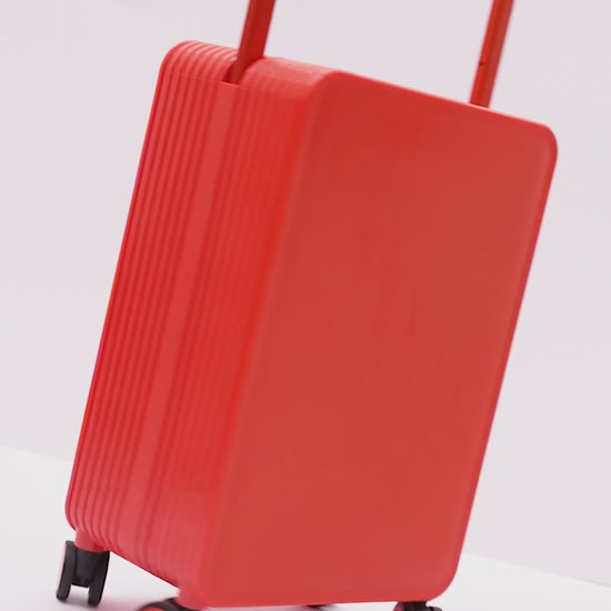 Orange cabin trolley highlighting TSA lock, thick smooth aluminum tie rod, and double spinner wheels