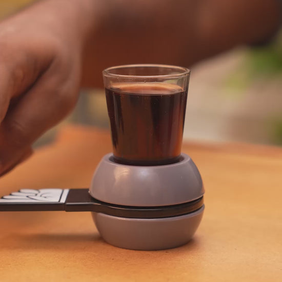 People paying shot glass spinner game.