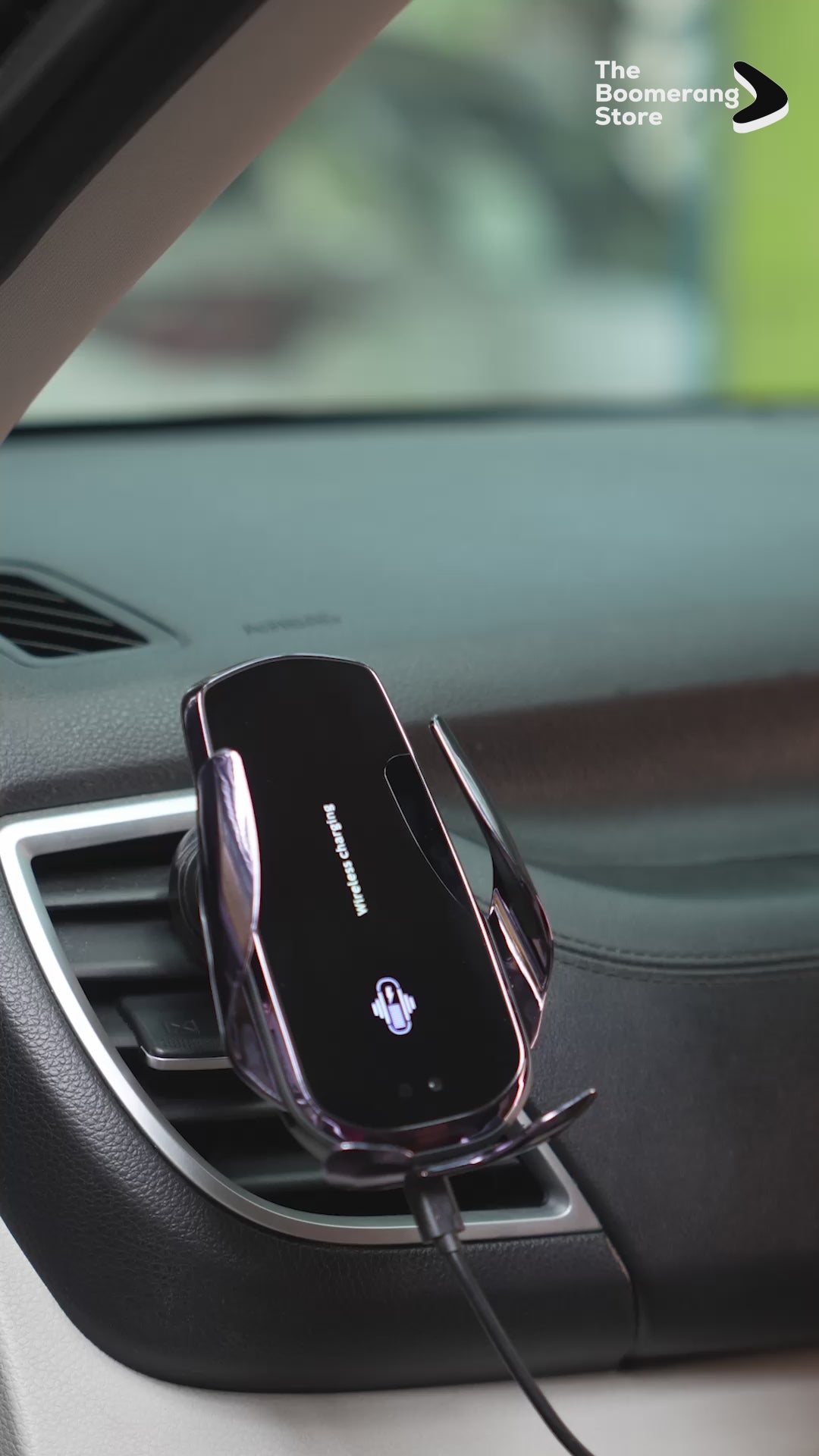 Automatic locking car phone holder with touch sensor, shown in dashboard vent.